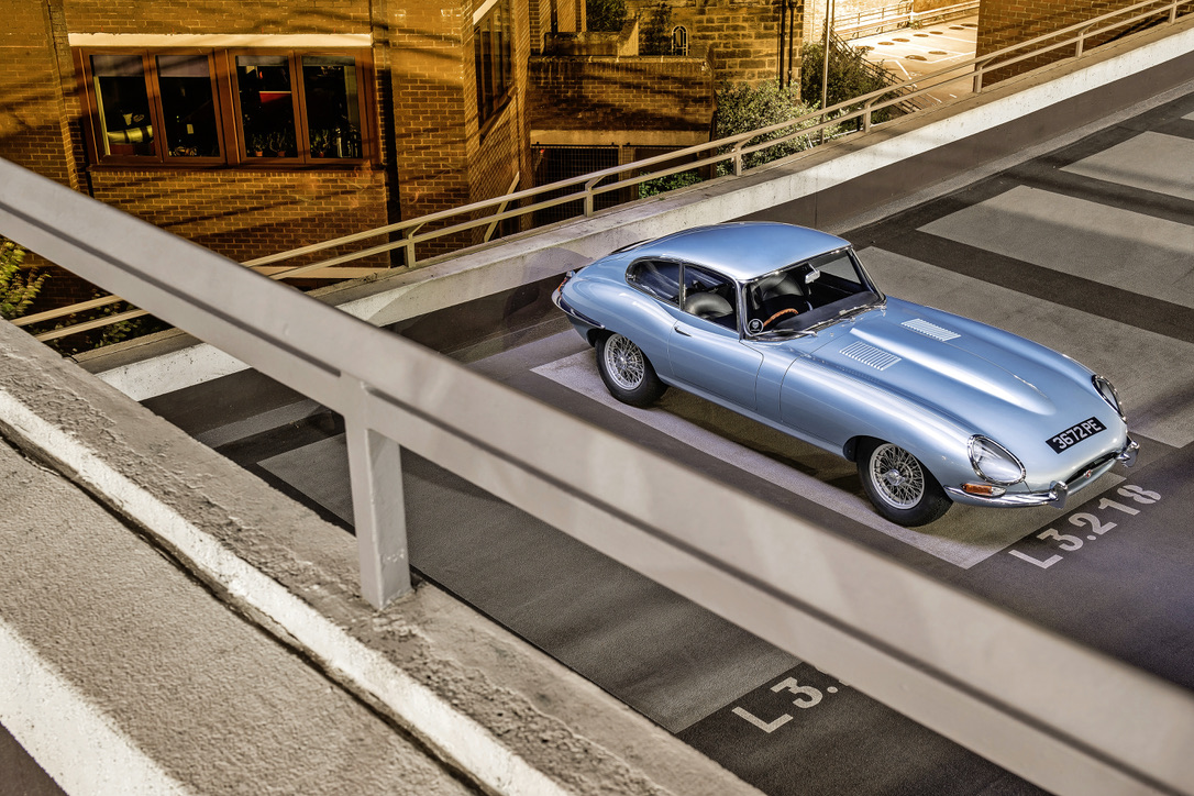 Blue Jaguar E-type photographed on a car park ramp